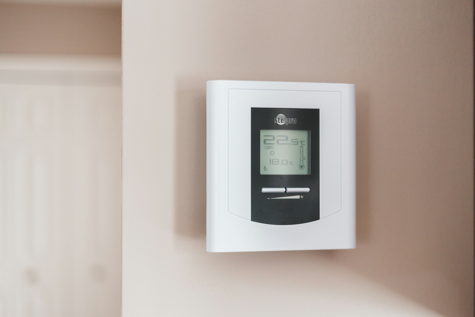 A wall thermostat in a UK home